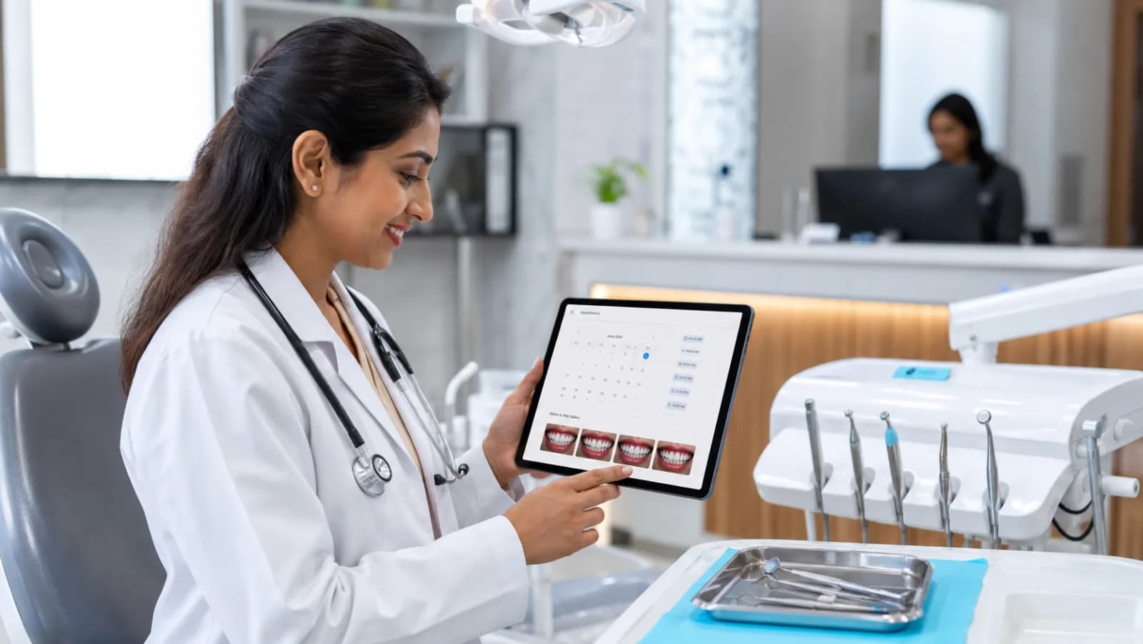 Indian dentist reviewing modern dental clinic website on tablet with appointment calendar and before-after gallery visible
