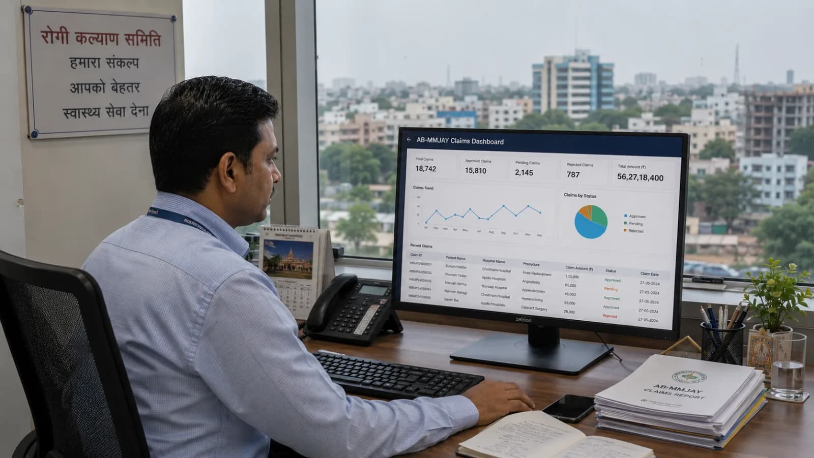 Madhya Pradesh hospital administrator reviewing AB-MMJAY Niramayam claims dashboard with ABDM compliance status and Hindi UI patient registration visible