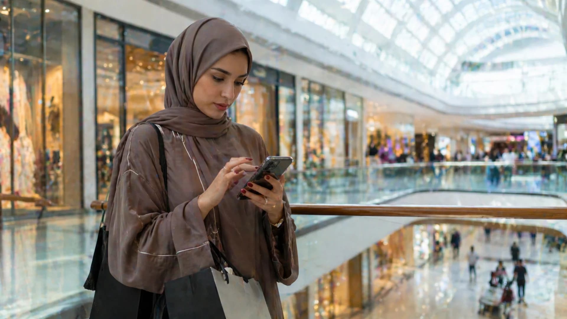 Tabby BNPL integration — young UAE shopper using Tabby Pay-in-4 on phone at Dubai mall
